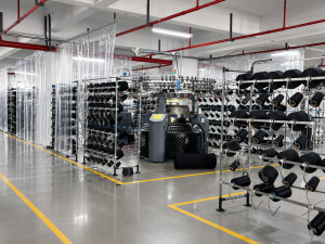 Knitting production area with yarn packages and machines
